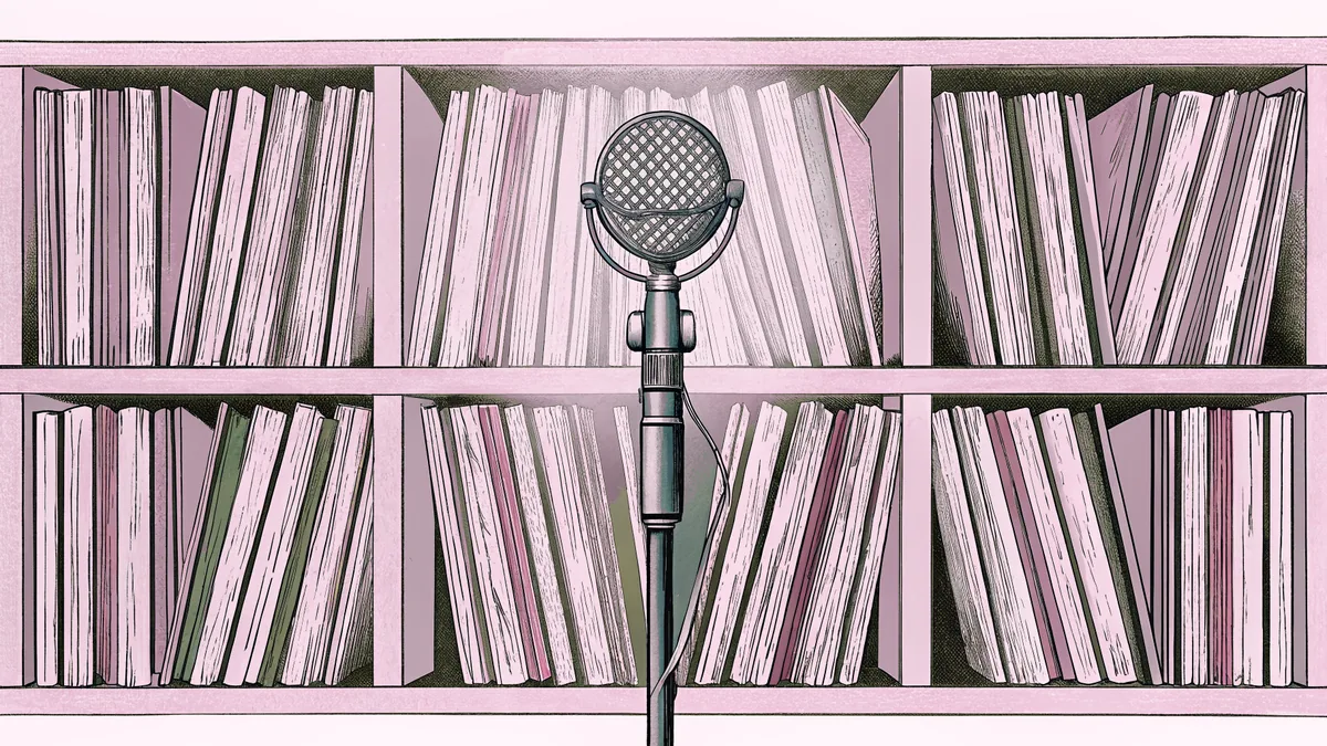 A professional microphone and collection of vinyl records arranged in a recording studio space.
