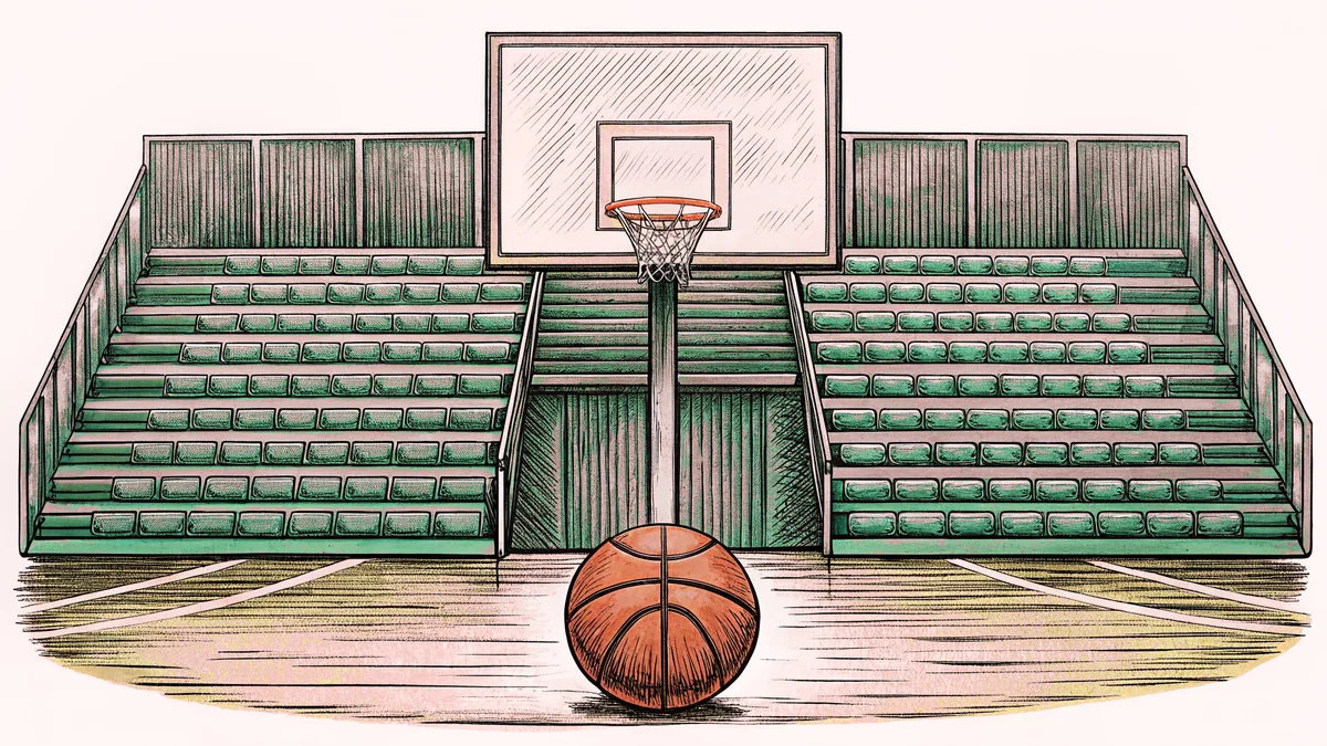 A basketball hoop and ball sit on a wooden court with empty bleachers behind.