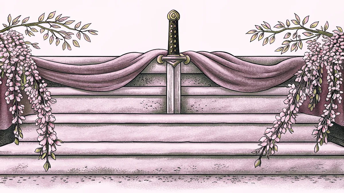 A sword laid across a stone step beside a drooping sprig of wisteria blossom.