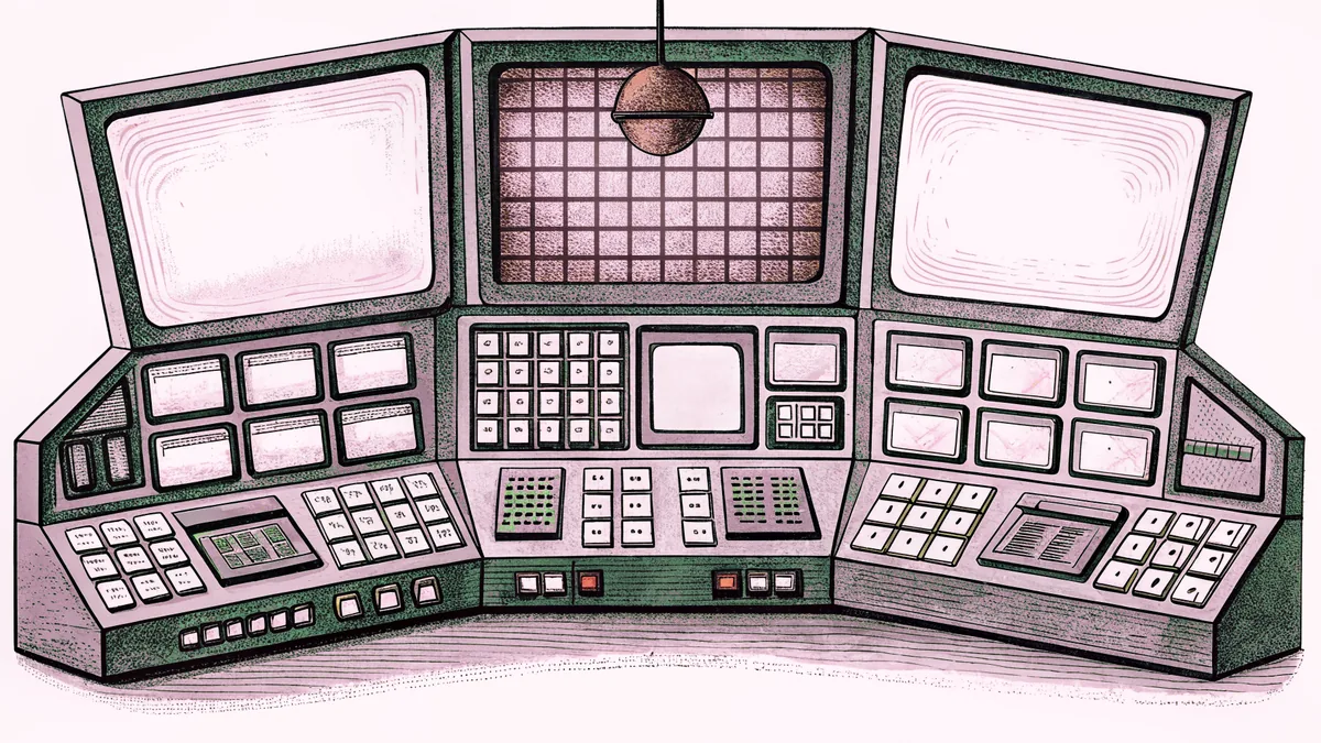 An on-air lamp glows above a control-room console with multiple monitors inside a studio.