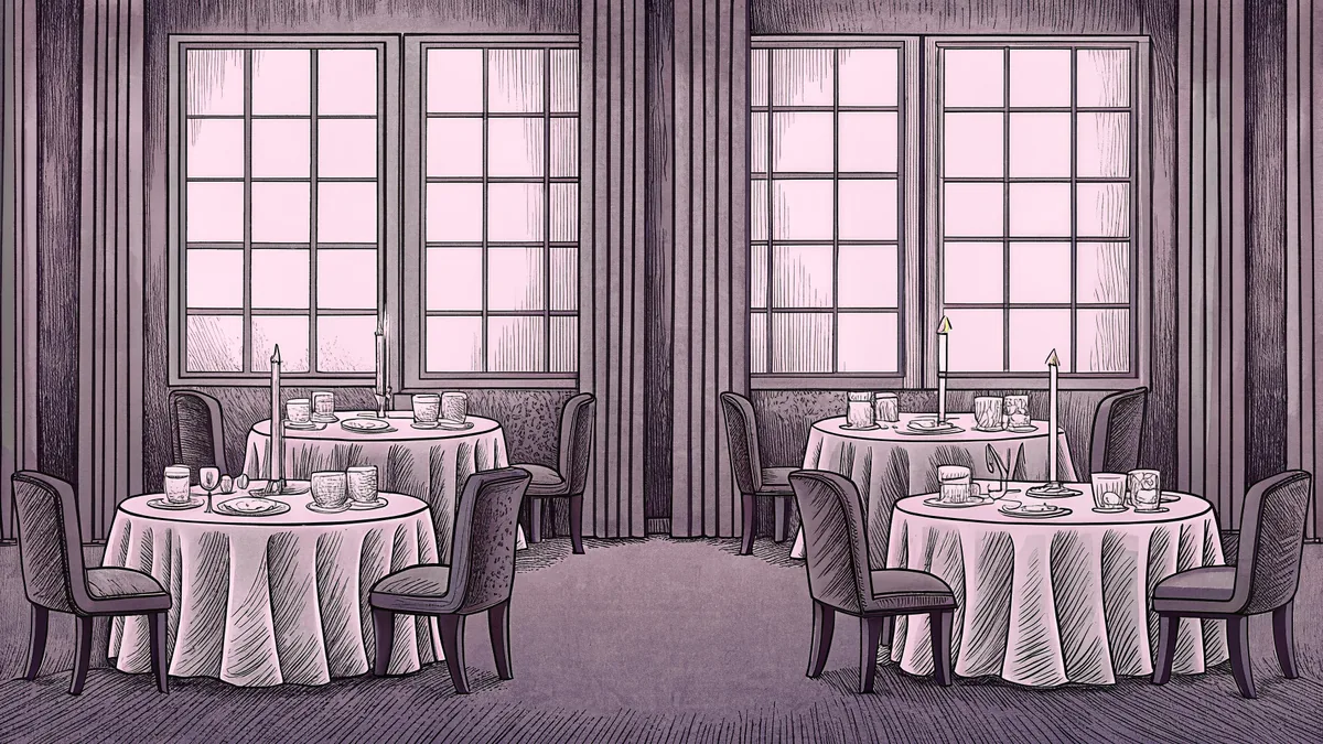 An elegant restaurant table displays fine china, crystal glasses, and candlelight.