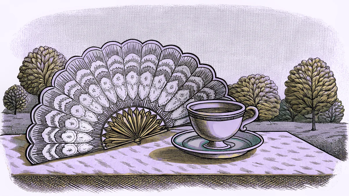 A lace fan and a porcelain teacup rest on a garden table in front of a country estate.