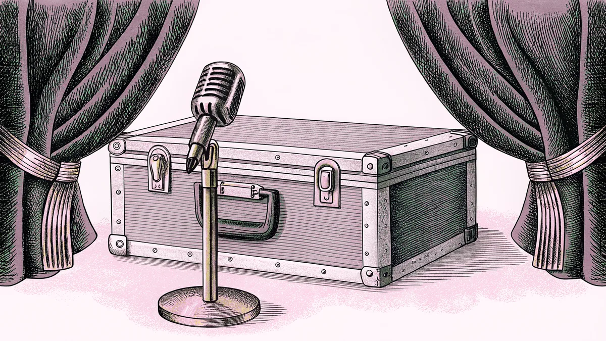 A chrome microphone on a stand beside a metal flight case, framed by draped curtains.