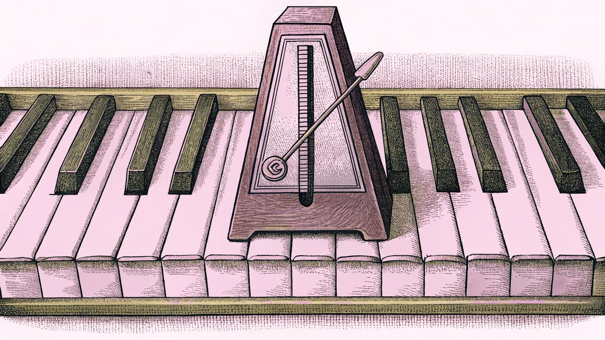 A metronome and tuning fork beside piano keys pressed into a three-note chord.