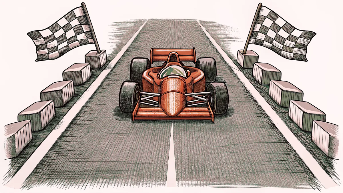 A red race car sits on an asphalt track beside a waving checkered flag.