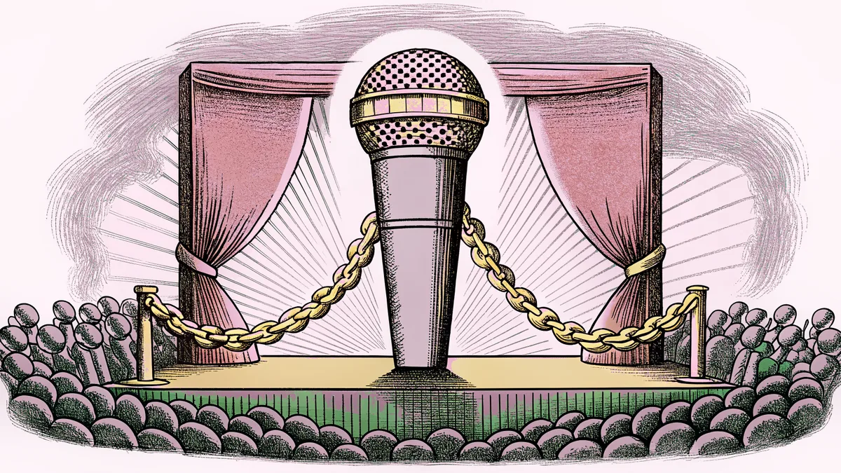 A microphone and gold chain jewelry rest on a concert stage beneath vibrant LED stage lighting.