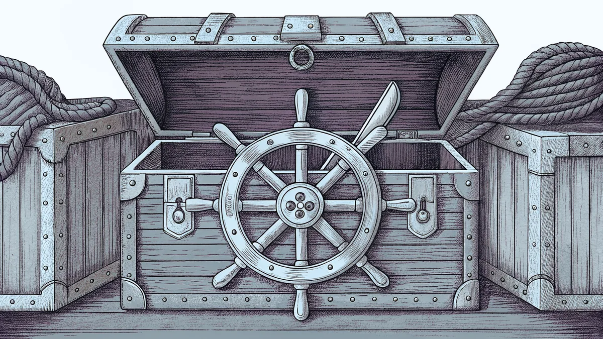 An open treasure chest with a cutlass, ship's wheel and brass spyglass.
