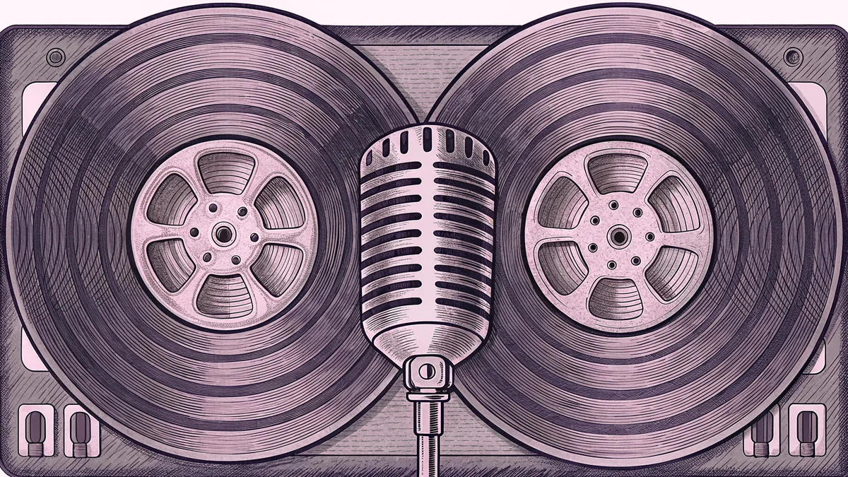 A vinyl record with a spoked metal centre, beside a chrome microphone.
