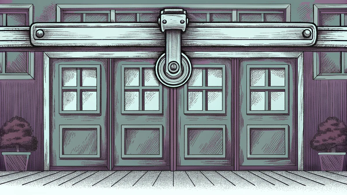 A jointed metal claw beside a small caster wheel.