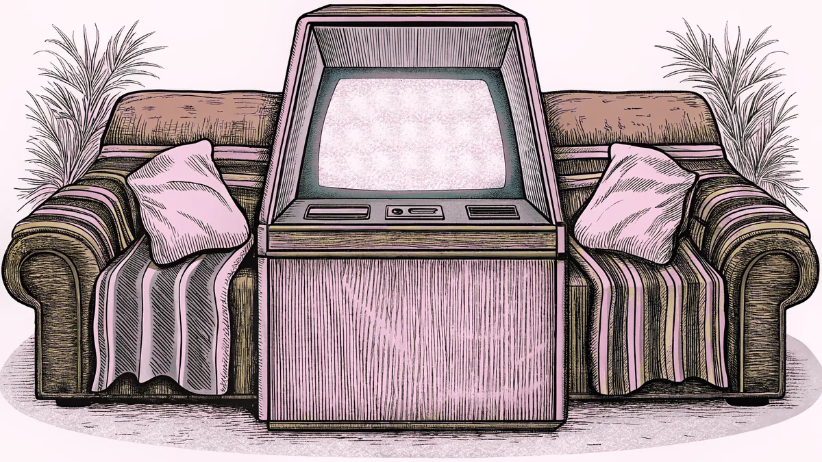 A vintage arcade cabinet with glowing screen stands beside a cozy sofa with blankets.
