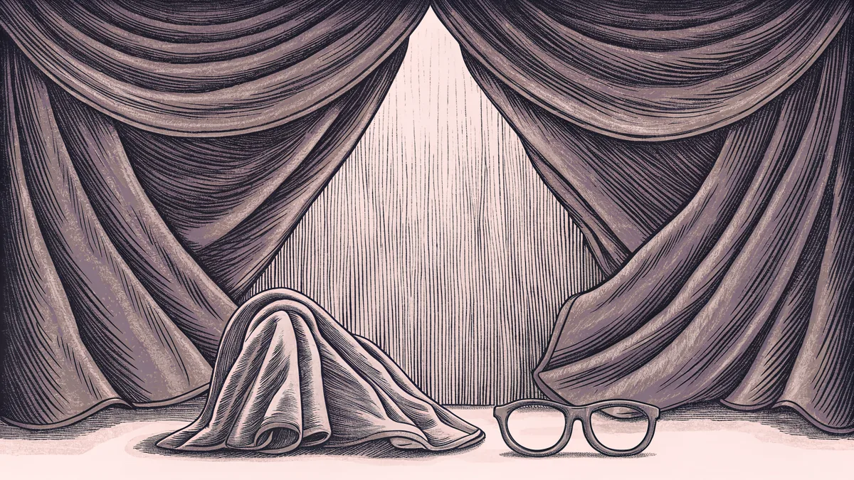 Round glasses rest beside a folded cape and a plain eye mask.