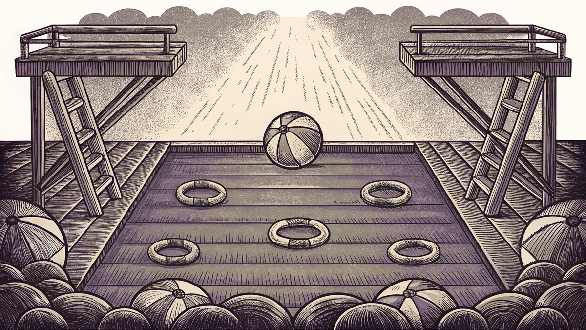 A diving board overlooks a pool filled with floats and a beach ball.