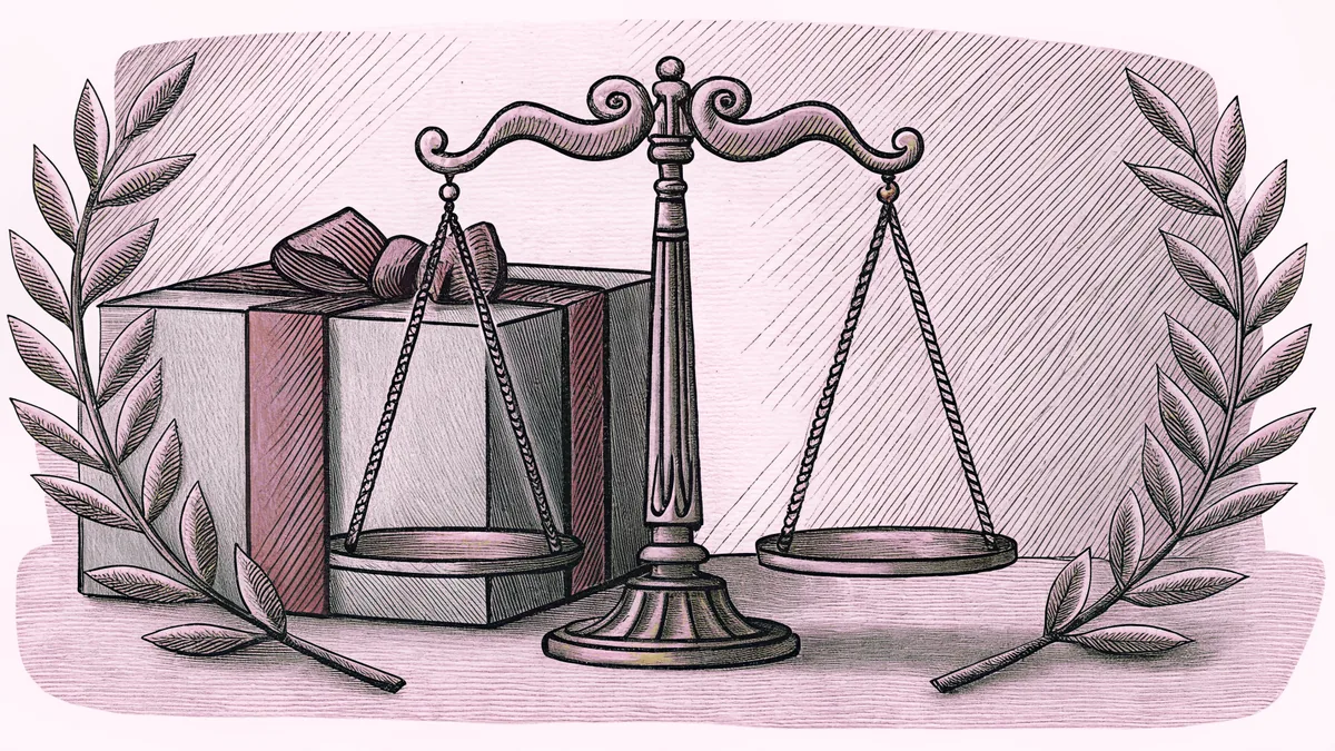 A balance scale rests beside a wrapped gift box and a golden laurel wreath.