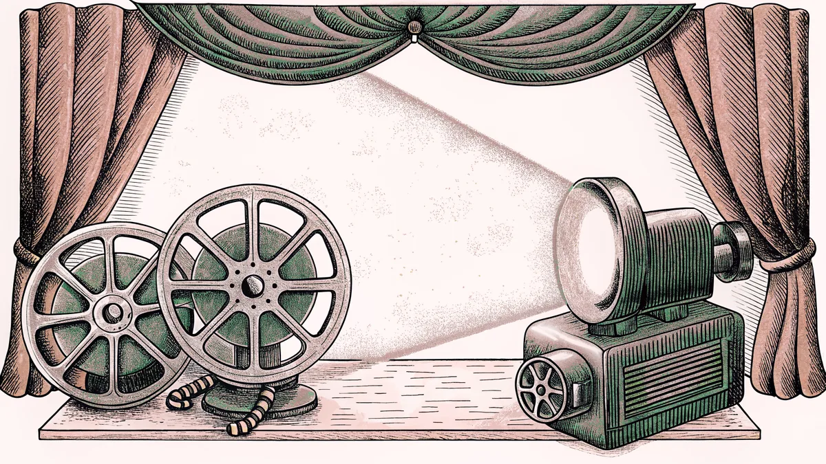 A film reel and projector rest beside a spotlight on a workbench.