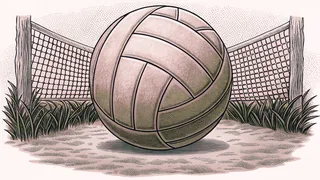 A volleyball resting against a taut net on a sunlit sand court.