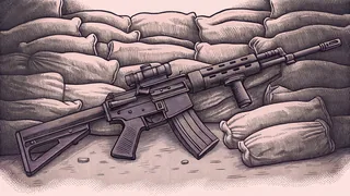 An airsoft rifle with loaded magazines positioned on a mock battlefield setup.