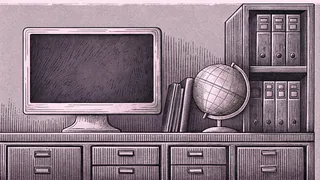 A computer monitor and globe sit on a desk beside a metal filing cabinet.