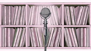 A professional microphone and collection of vinyl records arranged in a recording studio space.