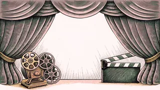 Cinema equipment including a projector lens and blank clapper board lit by stage spotlights.