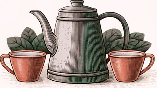 A brass coffee pot with a long curved spout beside two small cups.
