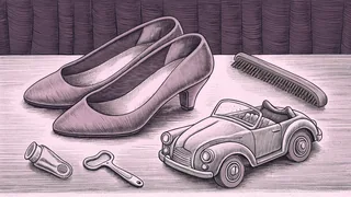 A pair of pink high heels sits beside a hairbrush and a small convertible toy car.