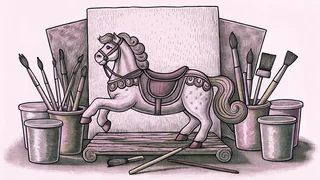 Colorful paint pots and brushes rest beside a carousel horse in an artist's workspace.