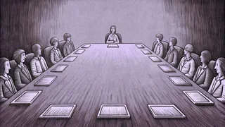 A leadership conference room shows people gathered around a long wooden table.