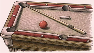 A cue stick and colored billiard ball rest on a green felt table with chalk nearby.