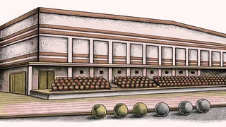 Bowling alley with pins at the end and polished lane.