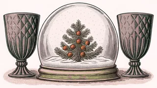 A decorative snow globe with crystalline patterns positioned near frosted glass containers.