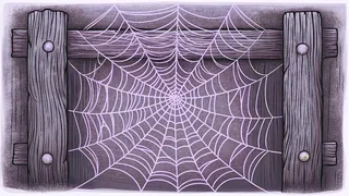 A delicate spider web sparkles with dewdrops on a wooden barn fence.