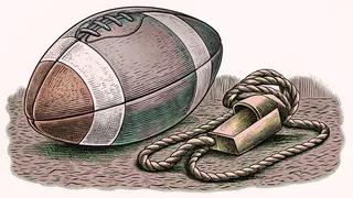 A worn leather football beside a brass whistle on a cord.