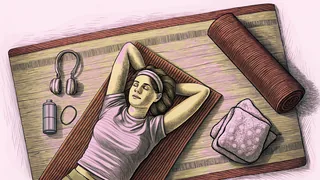 Person stretching on a yoga mat while enjoying music through headphones.