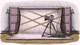 A studio camera sits beside yellow crime-scene tape in dramatic low light.