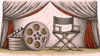 Film production elements including a reel and clapper board with a director's chair on set.