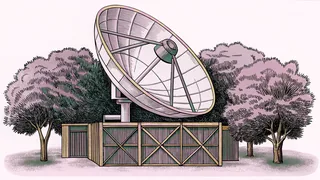A satellite dish and projector lens rest on a metal workbench in a studio.