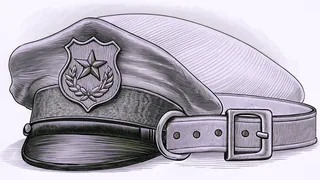 A police badge and cap rest beside a dog collar on a station desk.