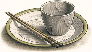 Dining utensils and tableware gather around a place setting.
