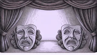 A pair of comedy and tragedy masks rests beside a spotlight on an empty stage.