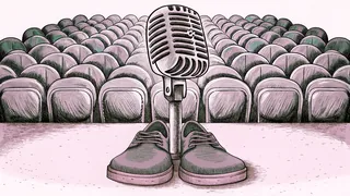 A pair of suede shoes beside a chrome microphone.
