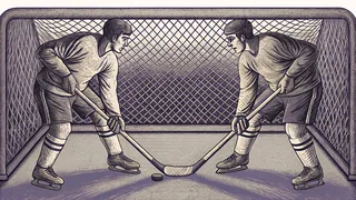 Floor hockey players on an indoor court with a stick, puck, and goal net during an active match.