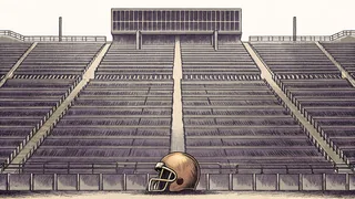 Football field with equipment and stadium seating.