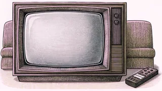 A boxy television set sits beside a remote control on a side table.