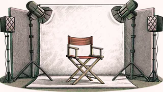 A director's chair stands on a soundstage with a boom microphone and studio lights.