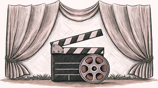 A clapper board and film canister sit before a plush velvet curtain.