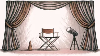 A red velvet theater curtain with stage spotlight and director's chair on a professional soundstage.
