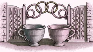Two cups sit on a table beside a pair of linked paper rings and an open garden gate.