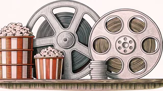A cinema projector sits on a shelf surrounded by classic film reels and vintage popcorn boxes.