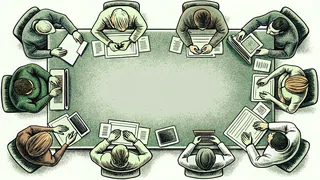 Office workers collaborating at desks with computers, phones, and scattered papers
