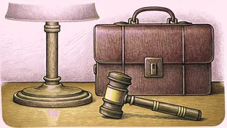 A bronze gavel sits beside a leather briefcase on a polished wooden desk.